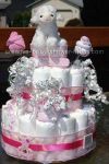 white lamb diaper cake with pink and white sock roses