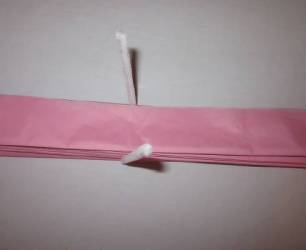 white pipe cleaner around tissue papers