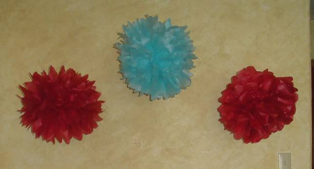 red and blue tissue pom poms