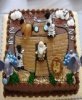 sheetcake designed to look like noahs ark with fisher price animal toys on it