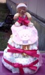 yellow bear diaper cake with pink accents