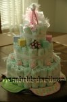 green and pink stork diaper cake with pink roses