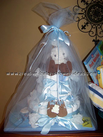 brown and blue boy diaper cake wrapped in tulle