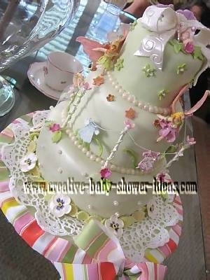 closeup of clothesline and bow on baby shower cake