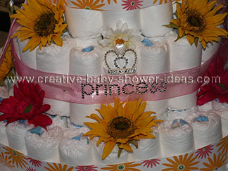 closeup of princess diaper cake with rhinestone crown