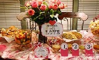 pink table at a baby shower with sign that says shower with love and different containers of baby food for a taste testing game