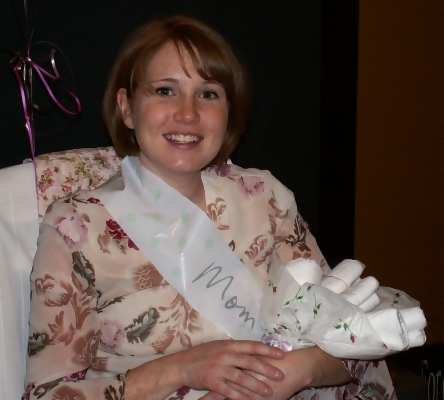 pregnant mom holding diaper bouquet