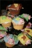 cupcake stand with sleeping babies covered with blankets