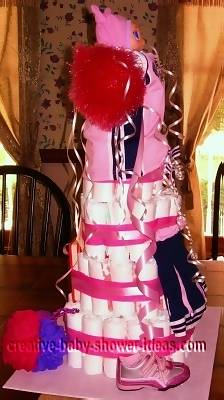 side of cheerleading diaper cake with cheer sneakers