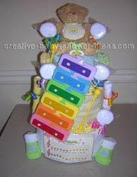 teddy bear diaper cake with xylophone toy