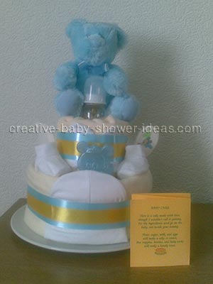 front of blue and gold bear diaper cake