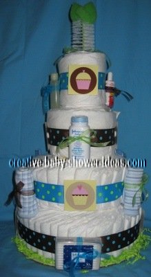 front of diaper cake with cupcake graphics and bottle brush on top