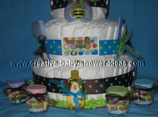 closeup of bottom of diaper cake with baby food bottle favors