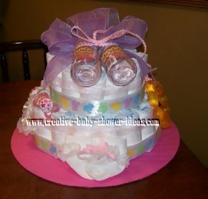 pink and purple bottles girl diaper cake