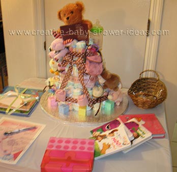 girl bear diaper cake on baby shower table