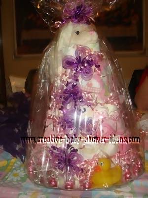 pink and purple lamb diaper cake wrapped in celophane