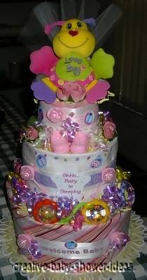 purple and pink love bug diaper cake