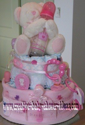 white and pink princess diaper cake