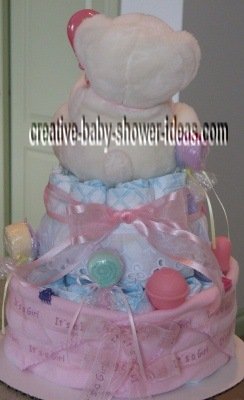 back of white and pink princess diaper cake