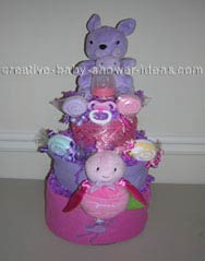 purple and pink princess diaper cake