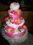 pink gerbera daisy and angel diaper cake