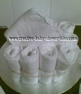 nappies being placed into diaper cake craft