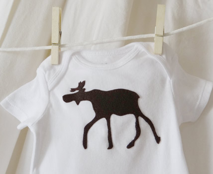 finished brown moose onesie hanging on clothesline