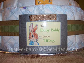 closeup of cute peter rabbit sign on diaper cake