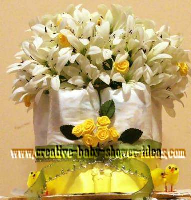 top of chic diaper cake with white flowers