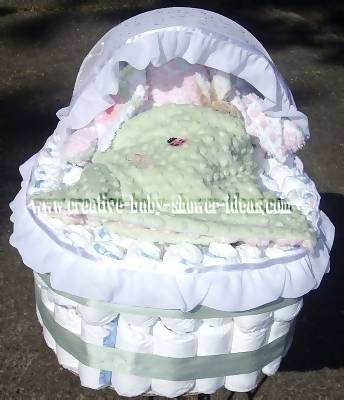 white and green diaper bassinet cake