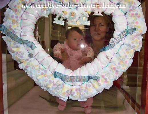 heart shaped diaper wreath with baby and aunt