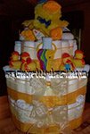 duck diaper cake with bright yellow ribbon and lots of rubber duckies