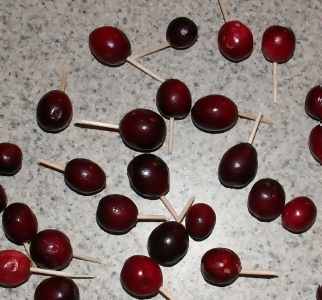 cranberries with toothpicks stuck into them