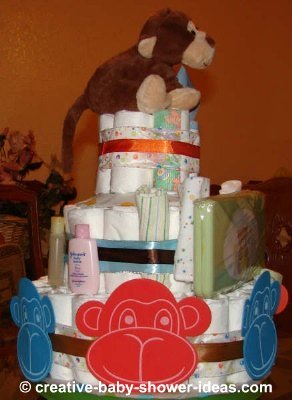 side view happy monkey faces diaper cake