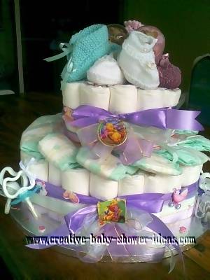 purple blue and white winnie the pooh diaper cake with booties