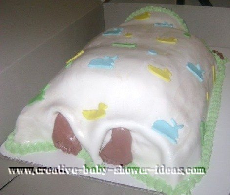 back of sleeping baby cake showing baby's toes peeking out