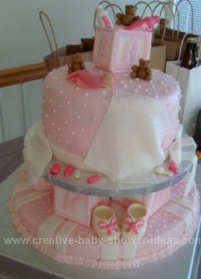 pink blankets blocks baby cake